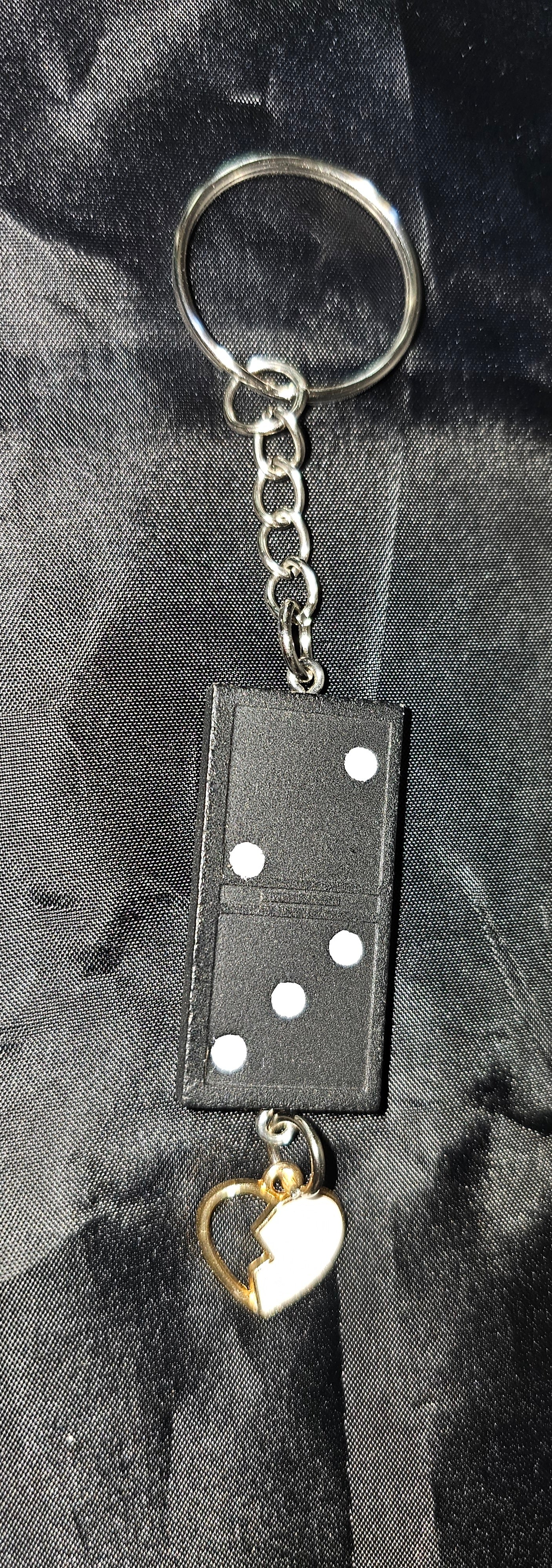Domino keychain with broken heart charm