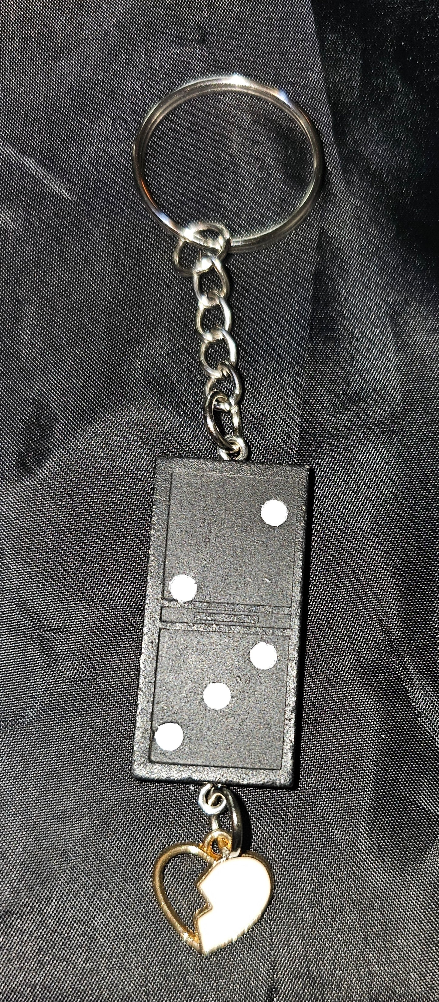 Domino keychain with broken heart charm