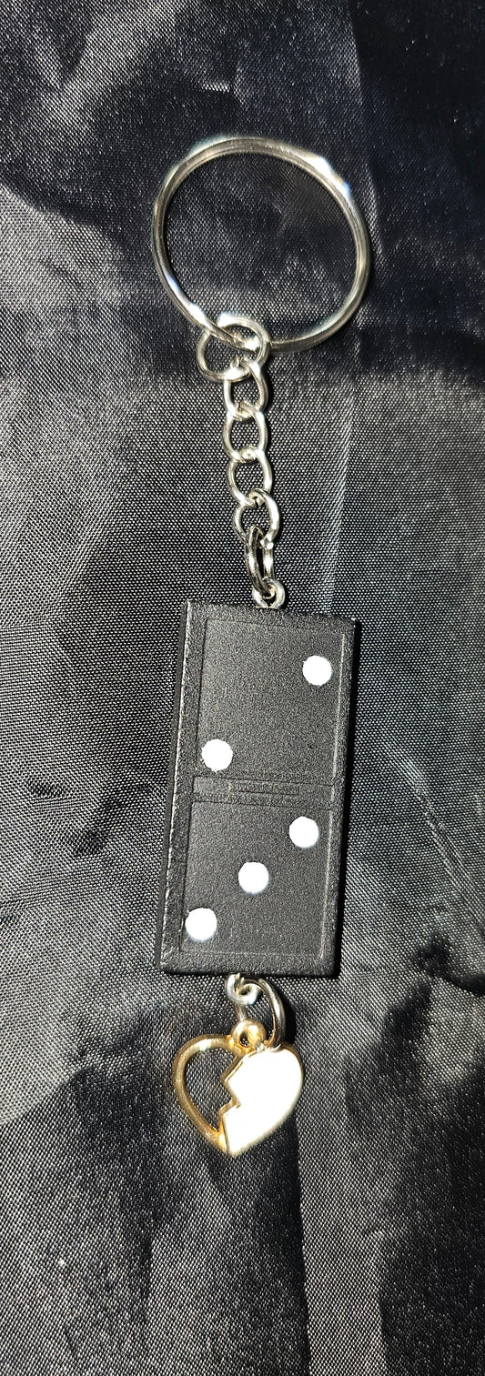 Domino keychain with broken heart charm